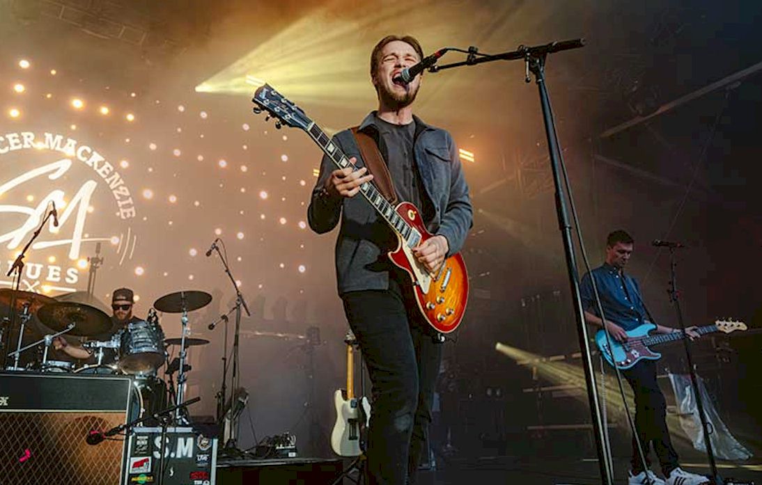 SPENCER MACKENZIE Honours His Forebears photo © Stephane Bourgeois- singing man with guitar on stage with bass player and drummer