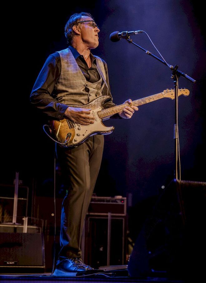 JOE BONAMASSA Tattoo’d Lady Photo Credit © Marcus Bird - man standing on stage playing electric guitar