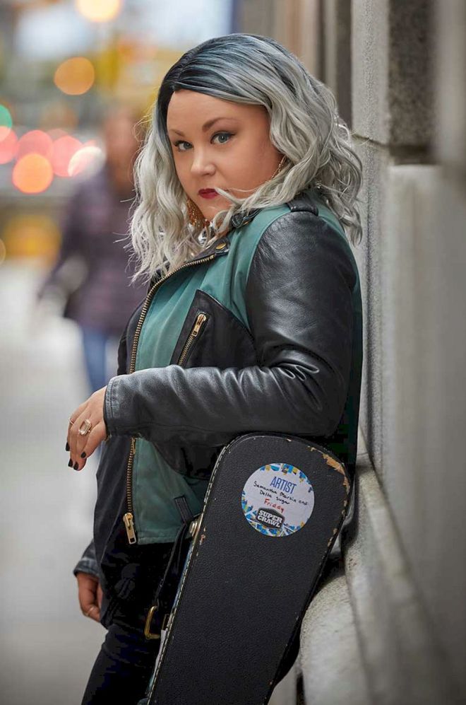 SAMANTHA MARTIN + DELTA SUGAR Them Changes - Photo Credit © Paul Wright - girl in leather jacket leaning against a wall with a guitar case