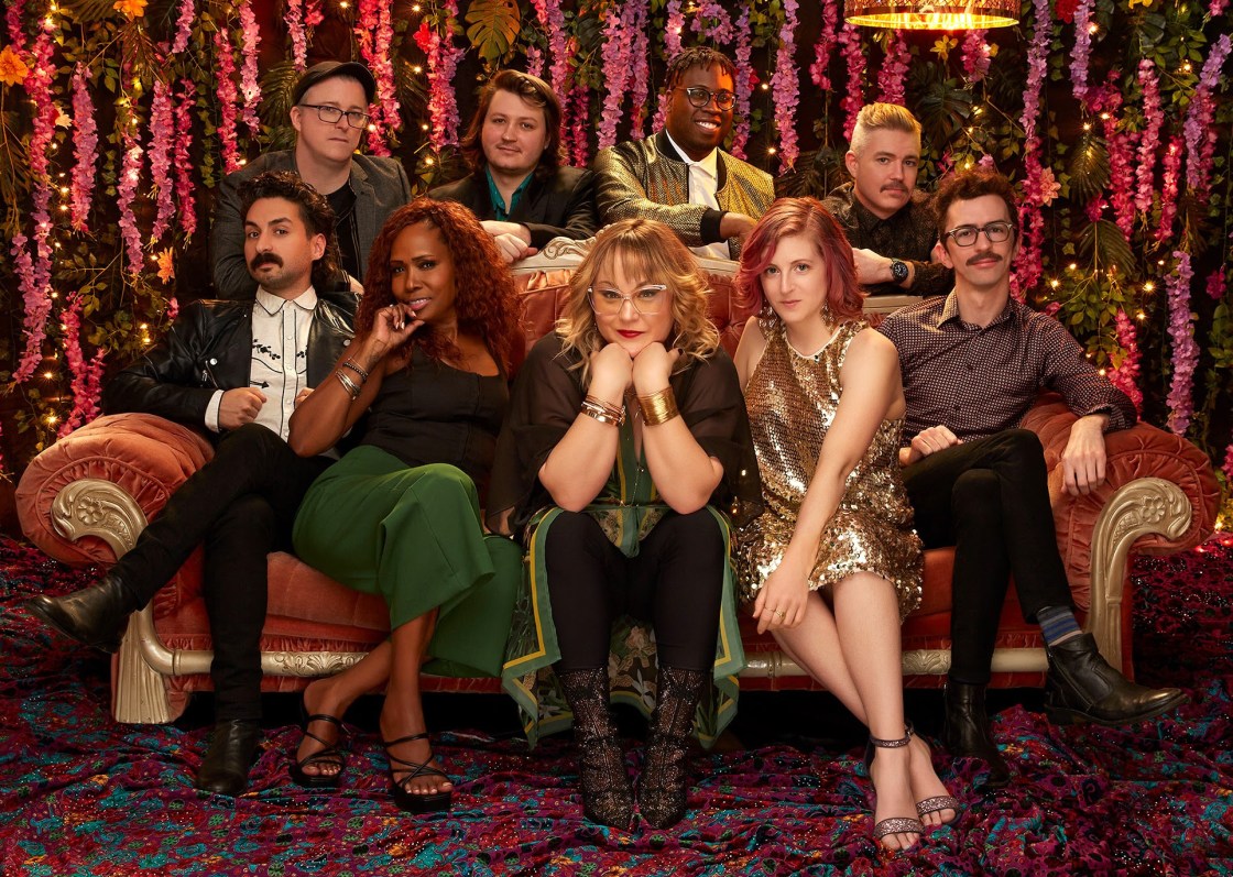 SAMANTHA MARTIN + DELTA SUGAR Go A Beautiful Buzz - photo credit Paul Wright - six men and three women seated on an ornate sofa with a velvet curtain behind
