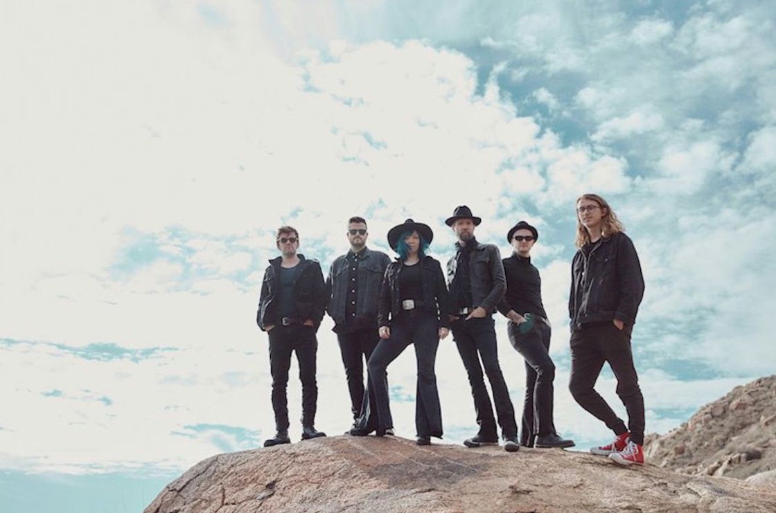 Beaux Gris Gris + the Apocalypse Me-Ye-Ye-Yow - photo Kaelin Davis - a photo of six figures all wearing black, standing on a drystone cliff edge