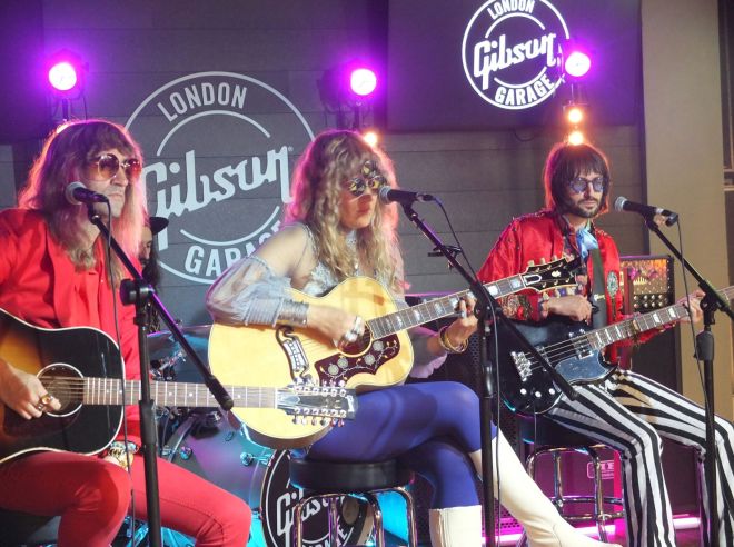 THE DAMN TRUTH Gibson Garage London - three musicians all with guitars on stage at Gibson Garage London