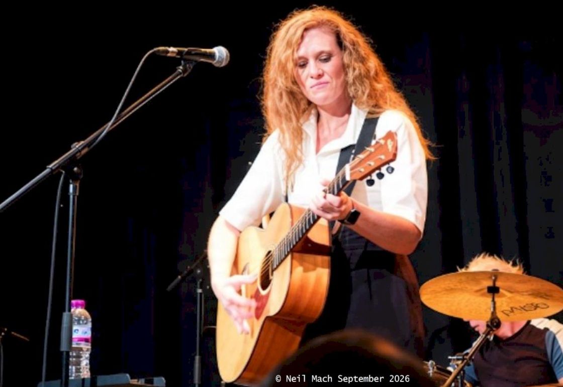 HOLLIE ROGERS Ropetackle Arts Centre, Shoreham-by-Sea photo credit © Neil Mach - girl singer with red hair and acoustic guitar on stage
