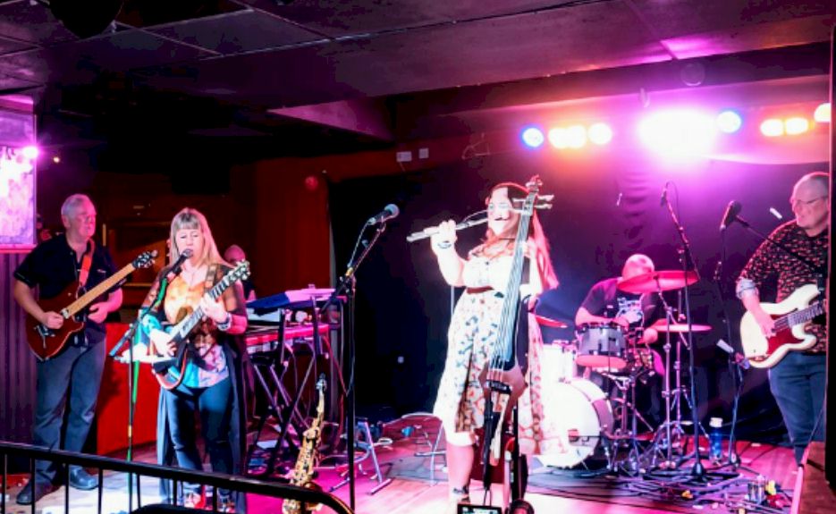 IMAGINARIUM Festival at Facebar Reading - photo © Neil Mach - Kindred Spirit on stage at Facebar reading with flute player, bassist, guitar player, keyboard player, drummer, and lead singer